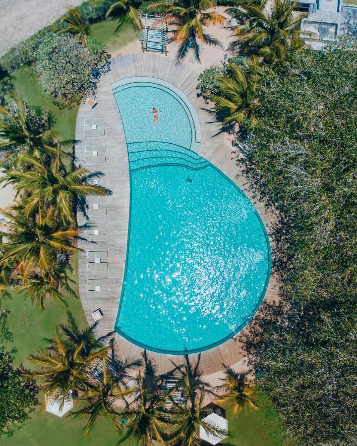 Lux* Grand Gaube Resort & Villas Exteriér fotografie Aerial view of the pool at the 2019 World Championships